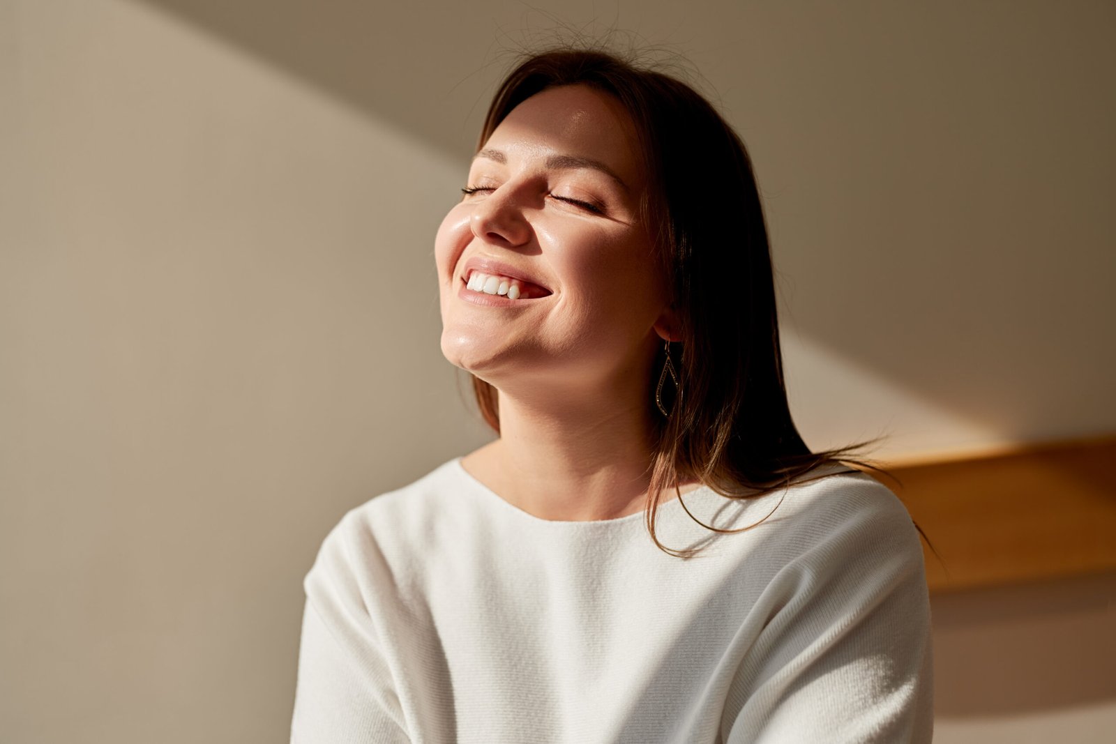 A joyful man laughing heartily